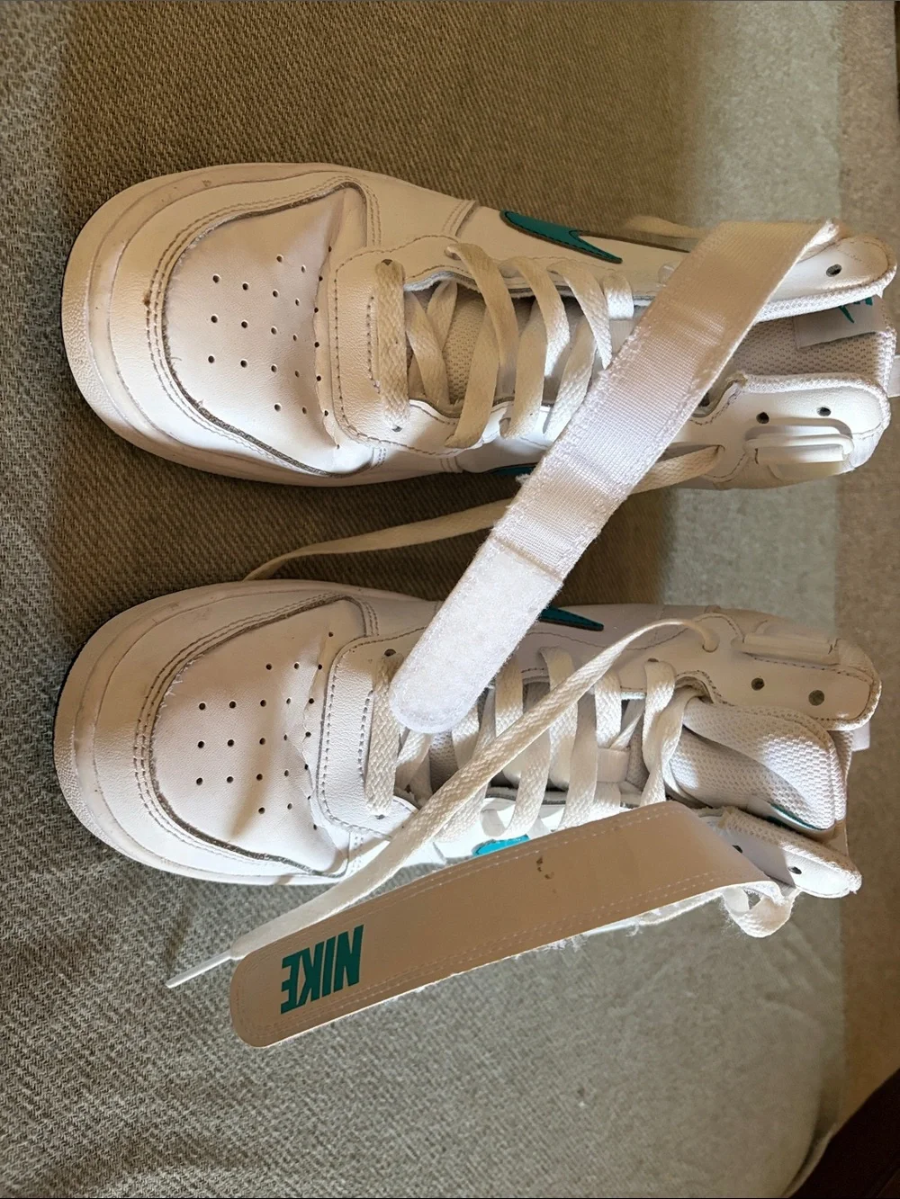 Nike White Youth High-Top Sneakers with Teal Swoosh
